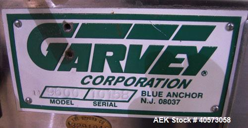 Used Garvey Conveyor, Model 9600. 3 1/4" wide x 78" long plastic belt. Driven by a 3/4 hp, 90 volt, 1750 rpm DC gearmotor, ratio 15 to 1. Includes a Reliance VS drive. Mounted on a stainless steel fr...