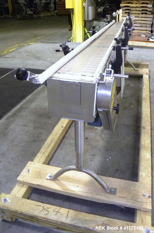 Used Garvey 9600 Series Tabletop Chain Conveyor. 7 1/2" wide X 96" long belt. Driven by a 1/2 hp, 90 volt, 1750 rpm DC gearmotor with a Reliance drive. All stainless steel frame and adjustable legs.