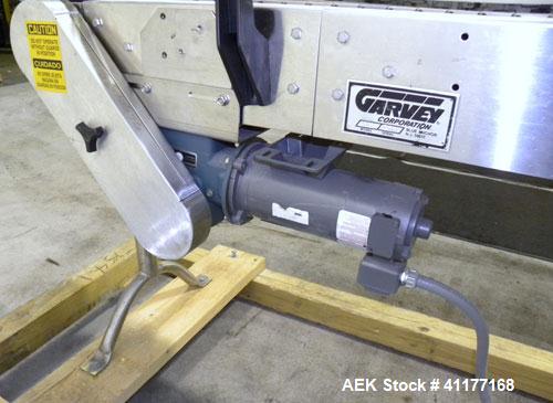 Used Garvey 9600 Series Tabletop Chain Conveyor. 7 1/2" wide X 96" long belt. Driven by a 1/2 hp, 90 volt, 1750 rpm DC gearmotor with a Reliance drive. All stainless steel frame and adjustable legs.
