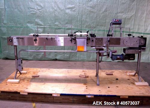 Used Garvey Conveyor, plastic belt 4 1/2" wide x 106" long. Driven by a 1/4 hp, 90 volt, 1750 rpm DC gearmotor, ratio 20 to 1. Includes a Reliance VS drive. Mounted on stainless steel legs.