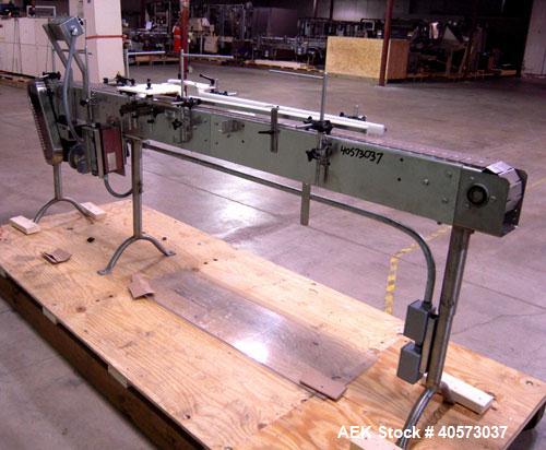 Used Garvey Conveyor, plastic belt 4 1/2" wide x 106" long. Driven by a 1/4 hp, 90 volt, 1750 rpm DC gearmotor, ratio 20 to 1. Includes a Reliance VS drive. Mounted on stainless steel legs.