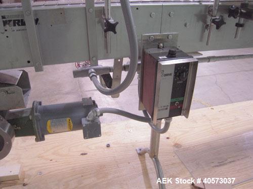 Used Garvey Conveyor, plastic belt 4 1/2" wide x 106" long. Driven by a 1/4 hp, 90 volt, 1750 rpm DC gearmotor, ratio 20 to 1. Includes a Reliance VS drive. Mounted on stainless steel legs.