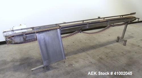 Used Plastic Belt Conveyor. 4" wide x 124" long belt. Driven by a 1/2 hp, 3/60/208-230/460 volt, 1725 rpm gearmotor, ratio 15 to 1. Mounted on a stainless steel frame and legs.