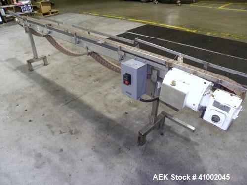 Used Plastic Belt Conveyor. 4" wide x 124" long belt. Driven by a 1/2 hp, 3/60/208-230/460 volt, 1725 rpm gearmotor, ratio 15 to 1. Mounted on a stainless steel frame and legs.