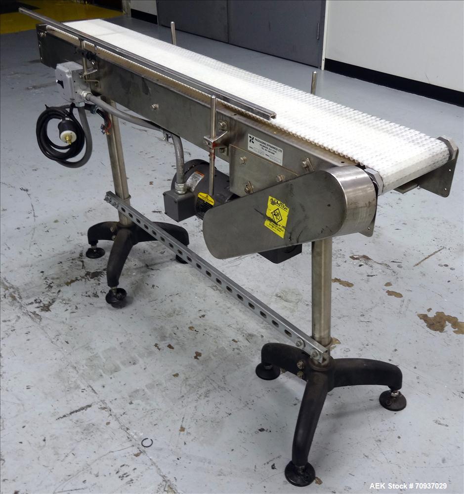Used Packaging Dynamics Model PC-KVP5 Conveyor. Has 58" long x 8" wide Belt. Mounted on adjustable legs. Stainless steel construction.