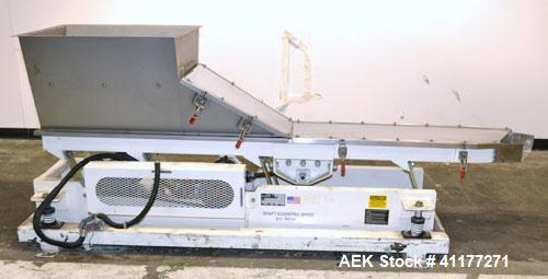 Used Deamco Vibrating Hopper Feeder, Model VHF-12X4X8-3, 304 Stainless Steel. 12" wide x 102’’ long trough. (2) Sections of clamp down top covers, 30’’ wide feed hopper. Driven by a 1hp, 3/60/230/460...