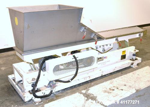 Used Deamco Vibrating Hopper Feeder, Model VHF-12X4X8-3, 304 Stainless Steel. 12" wide x 102’’ long trough. (2) Sections of clamp down top covers, 30’’ wide feed hopper. Driven by a 1hp, 3/60/230/460...