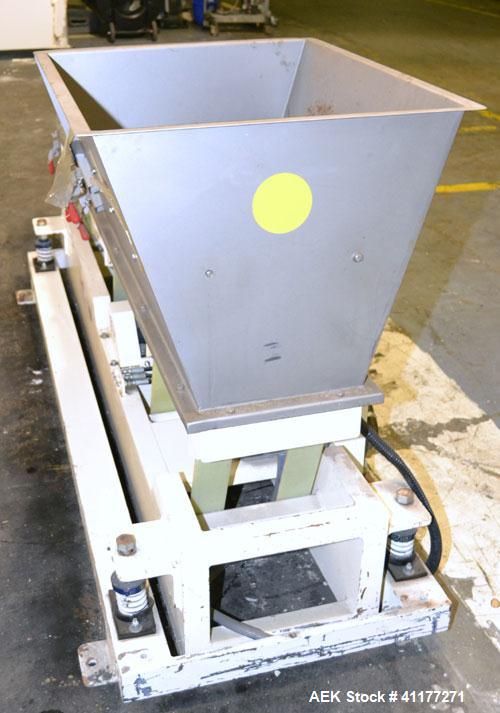Used Deamco Vibrating Hopper Feeder, Model VHF-12X4X8-3, 304 Stainless Steel. 12" wide x 102’’ long trough. (2) Sections of clamp down top covers, 30’’ wide feed hopper. Driven by a 1hp, 3/60/230/460...