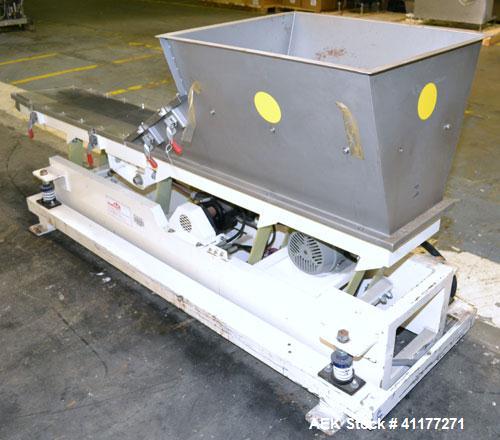 Used Deamco Vibrating Hopper Feeder, Model VHF-12X4X8-3, 304 Stainless Steel. 12" wide x 102’’ long trough. (2) Sections of clamp down top covers, 30’’ wide feed hopper. Driven by a 1hp, 3/60/230/460...
