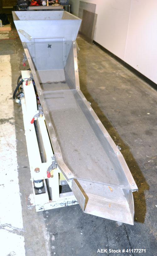 Used Deamco Vibrating Hopper Feeder, Model VHF-12X4X8-3, 304 Stainless Steel. 12" wide x 102’’ long trough. (2) Sections of clamp down top covers, 30’’ wide feed hopper. Driven by a 1hp, 3/60/230/460...