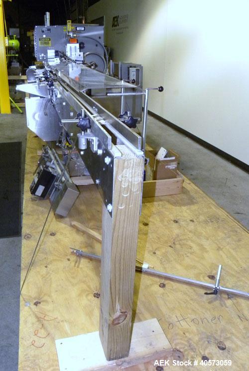 Used Lakso Cottoner 300. Fully automatic twin head cotton inserter capable of speeds up to 300 containers per minute with a maximum cotton weight range of 26 grams per yard and a cut length range of ...
