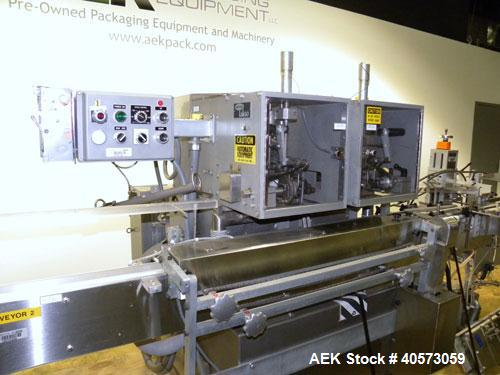 Used Lakso Cottoner 300. Fully automatic twin head cotton inserter capable of speeds up to 300 containers per minute with a maximum cotton weight range of 26 grams per yard and a cut length range of ...