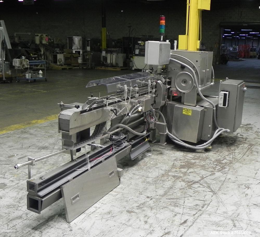 Used Lakso 450 Dual Station Inverted 'U' Cottoner. Machine has (2) cottoning heads for speeds up to 300 bottled per minute (depending on bottle size). Has a worm screw timing/alignment system. Comple...