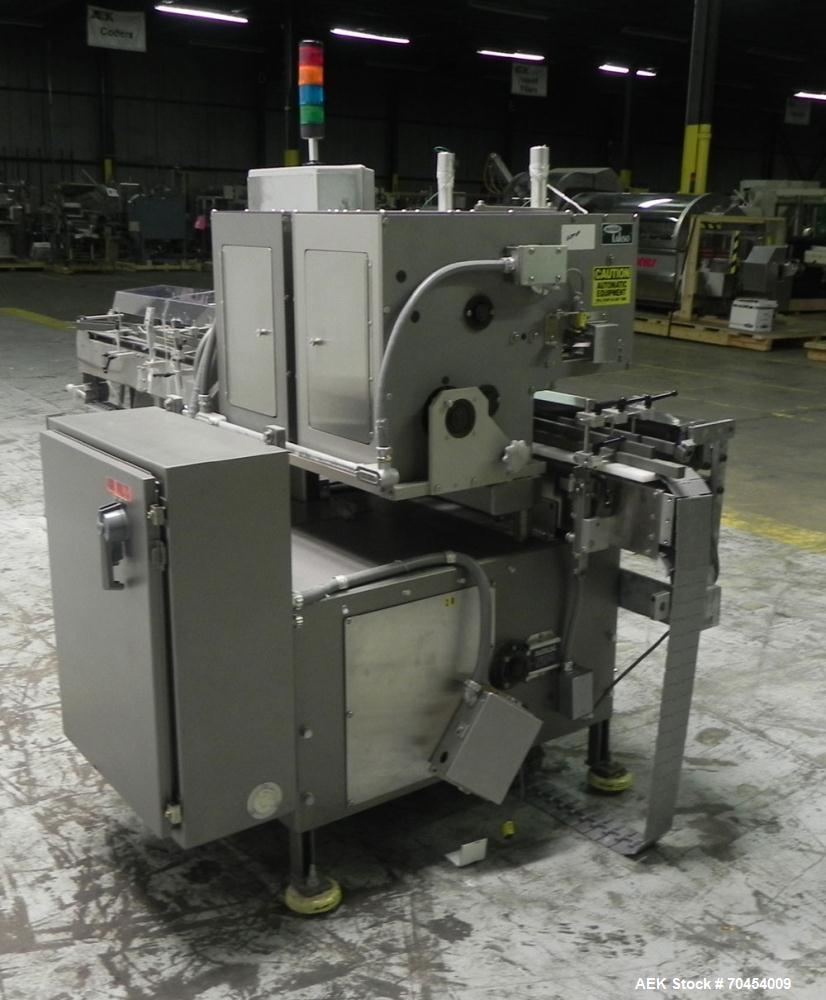 Used Lakso 450 Dual Station Inverted 'U' Cottoner. Machine has (2) cottoning heads for speeds up to 300 bottled per minute (depending on bottle size). Has a worm screw timing/alignment system. Comple...