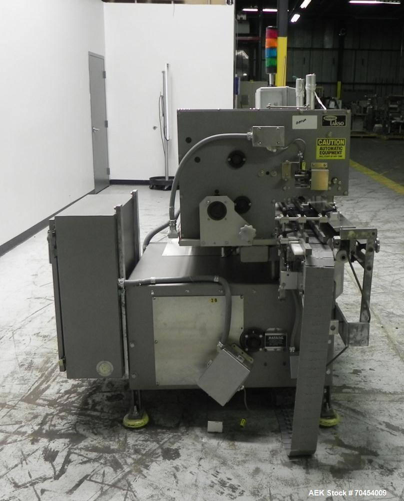 Used Lakso 450 Dual Station Inverted 'U' Cottoner. Machine has (2) cottoning heads for speeds up to 300 bottled per minute (depending on bottle size). Has a worm screw timing/alignment system. Comple...