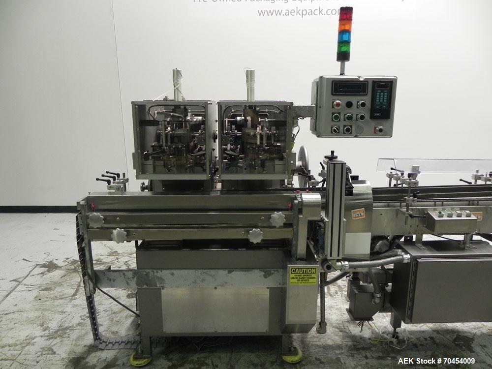 Used Lakso 450 Dual Station Inverted 'U' Cottoner. Machine has (2) cottoning heads for speeds up to 300 bottled per minute (depending on bottle size). Has a worm screw timing/alignment system. Comple...