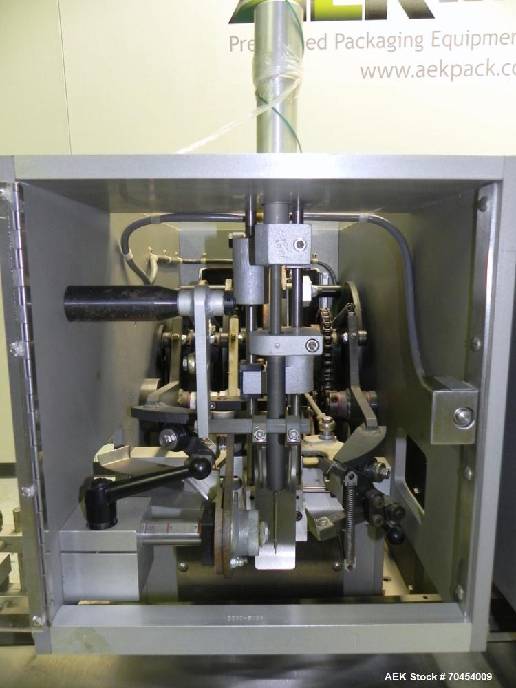 Used Lakso 450 Dual Station Inverted 'U' Cottoner. Machine has (2) cottoning heads for speeds up to 300 bottled per minute (depending on bottle size). Has a worm screw timing/alignment system. Comple...
