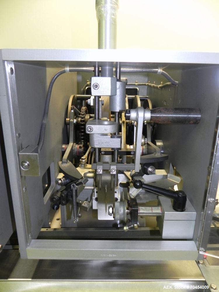 Used Lakso 450 Dual Station Inverted 'U' Cottoner. Machine has (2) cottoning heads for speeds up to 300 bottled per minute (depending on bottle size). Has a worm screw timing/alignment system. Comple...