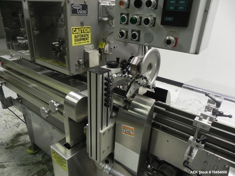 Used Lakso 450 Dual Station Inverted 'U' Cottoner. Machine has (2) cottoning heads for speeds up to 300 bottled per minute (depending on bottle size). Has a worm screw timing/alignment system. Comple...
