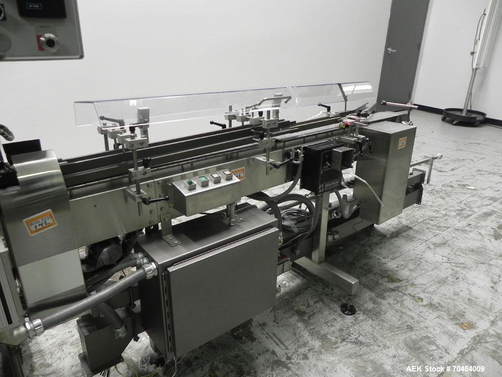 Used Lakso 450 Dual Station Inverted 'U' Cottoner. Machine has (2) cottoning heads for speeds up to 300 bottled per minute (depending on bottle size). Has a worm screw timing/alignment system. Comple...