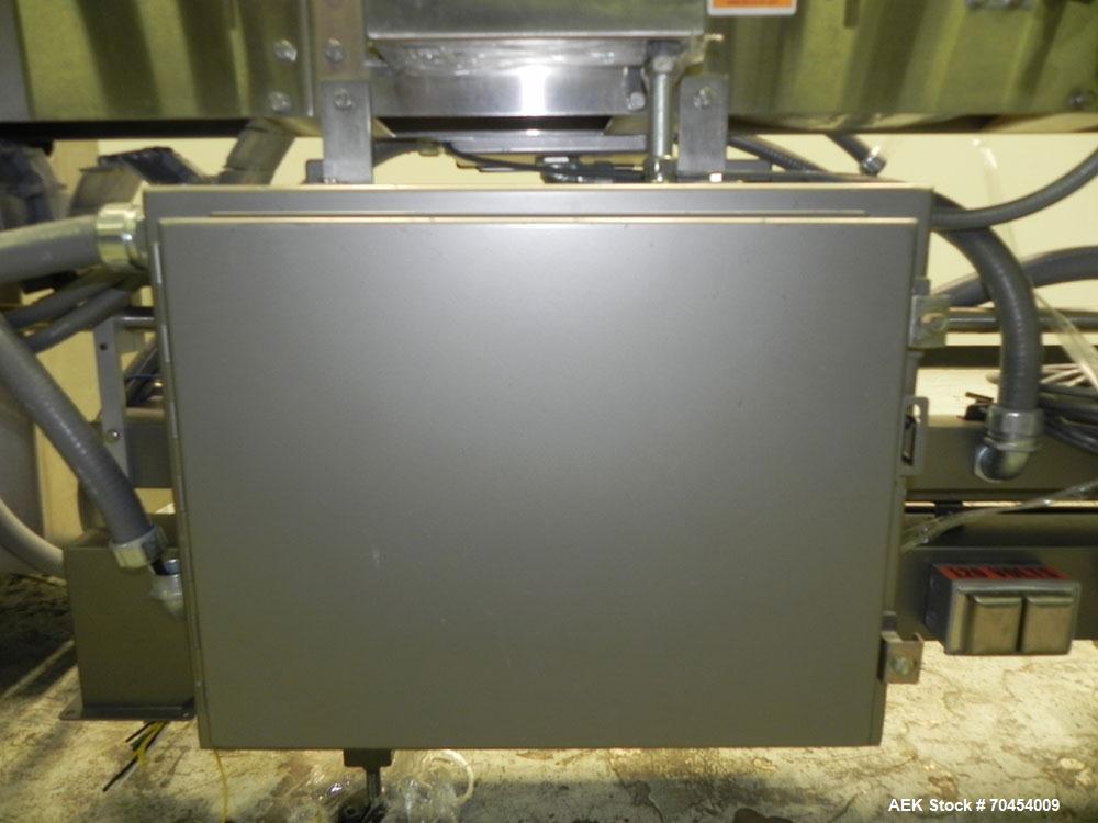 Used Lakso 450 Dual Station Inverted 'U' Cottoner. Machine has (2) cottoning heads for speeds up to 300 bottled per minute (depending on bottle size). Has a worm screw timing/alignment system. Comple...