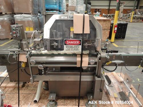 Used Lakso Model 71 Automatic Twin Head Cottoner capable of speeds up to 200 bottles per minute. Has 28" x 3-1/4" screw infeed. Can use natural or synthetic cotton up to 26 grams in inverted "U" conf...
