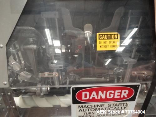 Used Lakso Model 71 Automatic Twin Head Cottoner capable of speeds up to 200 bottles per minute. Has 28" x 3-1/4" screw infeed. Can use natural or synthetic cotton up to 26 grams in inverted "U" conf...
