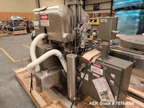 Used Lakso Model 71 Automatic Twin Head Cottoner capable of speeds up to 200 bottles per minute. Has 28" x 3-1/4" screw infeed. Can use natural or synthetic cotton up to 26 grams in inverted "U" conf...