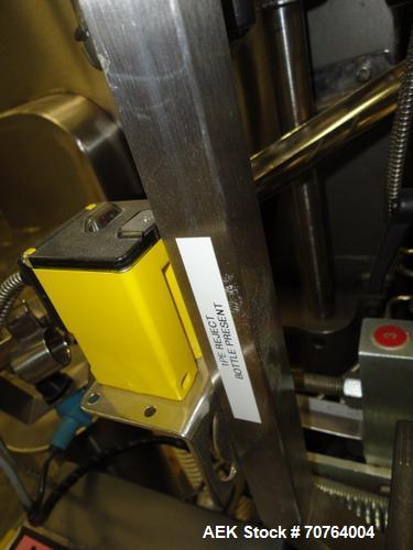 Used Lakso Model 71 Automatic Twin Head Cottoner capable of speeds up to 200 bottles per minute. Has 28" x 3-1/4" screw infeed. Can use natural or synthetic cotton up to 26 grams in inverted "U" conf...