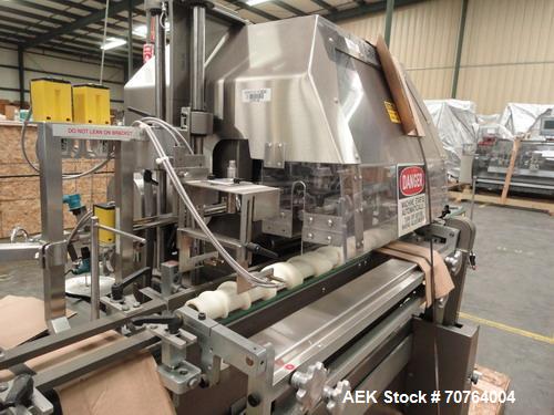 Used Lakso Model 71 Automatic Twin Head Cottoner capable of speeds up to 200 bottles per minute. Has 28" x 3-1/4" screw infeed. Can use natural or synthetic cotton up to 26 grams in inverted "U" conf...