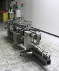 Used Lakso 450 Dual Station Inverted 'U' Cottoner. Machine has (2) cottoning heads for speeds up to 300 bottled per minute (depending on bottle size). Has a worm screw timing/alignment system. Comple...