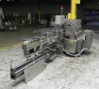 Used Lakso 450 Dual Station Inverted 'U' Cottoner. Machine has (2) cottoning heads for speeds up to 300 bottled per minute (depending on bottle size). Has a worm screw timing/alignment system. Comple...
