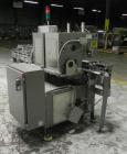 Used Lakso 450 Dual Station Inverted 'U' Cottoner. Machine has (2) cottoning heads for speeds up to 300 bottled per minute (depending on bottle size). Has a worm screw timing/alignment system. Comple...