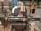Used Lakso Model 71 Automatic Twin Head Cottoner capable of speeds up to 200 bottles per minute. Has 28