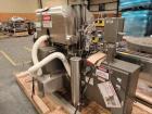 Used Lakso Model 71 Automatic Twin Head Cottoner capable of speeds up to 200 bottles per minute. Has 28