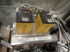 Used Lakso Model 71 Automatic Twin Head Cottoner capable of speeds up to 200 bottles per minute. Has 28