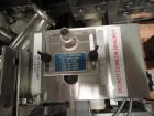 Used Lakso Model 71 Automatic Twin Head Cottoner capable of speeds up to 200 bottles per minute. Has 28
