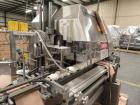 Used Lakso Model 71 Automatic Twin Head Cottoner capable of speeds up to 200 bottles per minute. Has 28