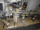 Used Lakso Model 71 Automatic Twin Head Cottoner capable of speeds up to 200 bottles per minute. Has 28