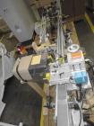 Used Lakso Model 71 Automatic Twin Head Cottoner capable of speeds up to 200 bottles per minute. Has 28