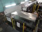 Used Priority One Low-level Bulk Depalletizer. Rated for glass or PET, 460 VAC 3 Phase 60 Hertz. Low-level container discharge, manual top-frame, stretch film and strap removal. Pallet stacker and sl...