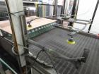 Used Priority One Low-level Bulk Depalletizer. Rated for glass or PET, 460 VAC 3 Phase 60 Hertz. Low-level container discharge, manual top-frame, stretch film and strap removal. Pallet stacker and sl...