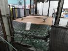 Used Priority One Low-level Bulk Depalletizer. Rated for glass or PET, 460 VAC 3 Phase 60 Hertz. Low-level container discharge, manual top-frame, stretch film and strap removal. Pallet stacker and sl...