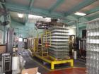 Used Priority One Low-level Bulk Depalletizer. Rated for glass or PET, 460 VAC 3 Phase 60 Hertz. Low-level container discharge, manual top-frame, stretch film and strap removal. Pallet stacker and sl...