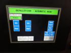 Used Priority One Low-level Bulk Depalletizer. Rated for glass or PET, 460 VAC 3 Phase 60 Hertz. Low-level container discharge, manual top-frame, stretch film and strap removal. Pallet stacker and sl...