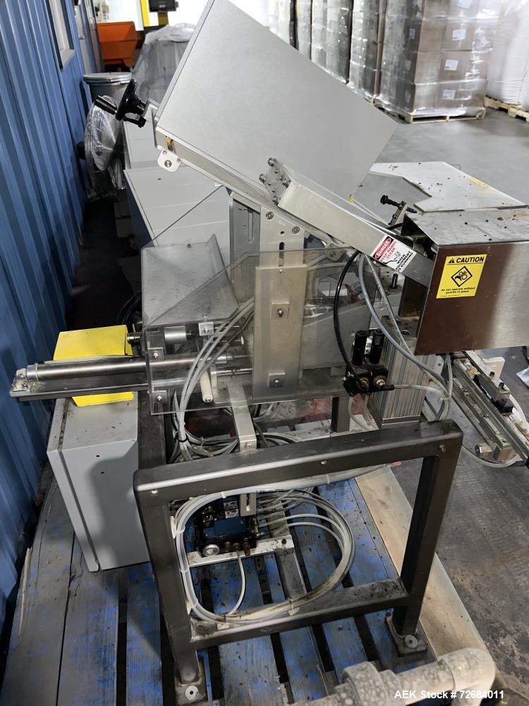 Used- Action Packaging Model Autocard ST2 Automatic Header Card Applicator. Speeds up to 25 cycles per minute, two cards per...