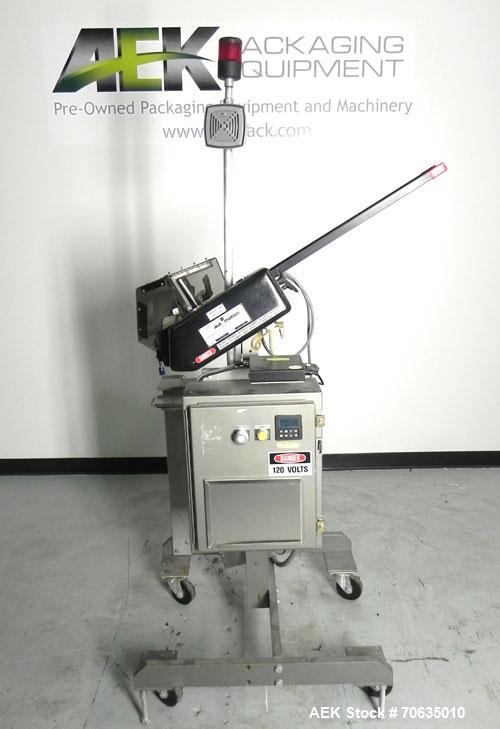 Used Minnesota Automation Model Special Reciprocating Coupon Feeder-Topserter. Capable of speeds up to 90 units per minute. Has self-contained Venturi style vacuum system. Has Allen Bradley SLC 500 P...