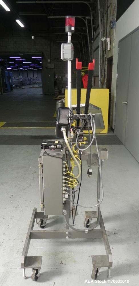 Used Minnesota Automation Model Special Reciprocating Coupon Feeder-Topserter. Capable of speeds up to 90 units per minute. Has self-contained Venturi style vacuum system. Has Allen Bradley SLC 500 P...