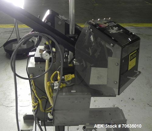 Used Minnesota Automation Model Special Reciprocating Coupon Feeder-Topserter. Capable of speeds up to 90 units per minute. Has self-contained Venturi style vacuum system. Has Allen Bradley SLC 500 P...
