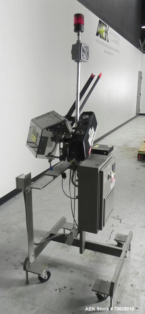 Used Minnesota Automation Model Special Reciprocating Coupon Feeder-Topserter. Capable of speeds up to 90 units per minute. Has self-contained Venturi style vacuum system. Has Allen Bradley SLC 500 P...